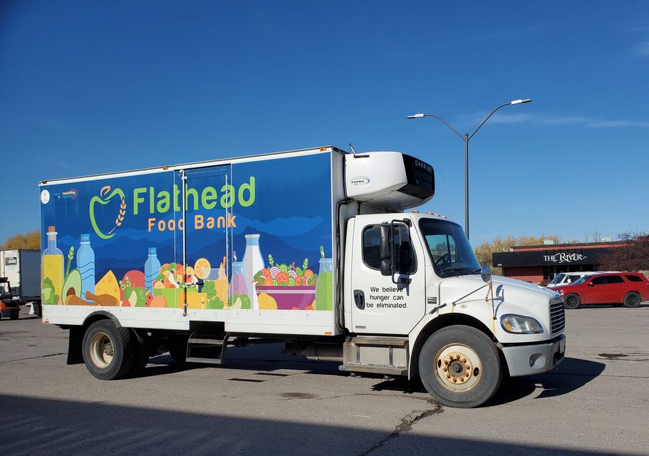 Staff Load Trucks Headed for Local Food Banks